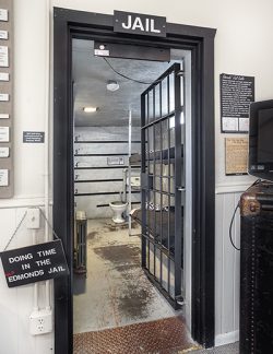 Top: Emily dressed as a Samurai in Japan.  Bottom: Museum's Interactive Historic Jail Cell.
