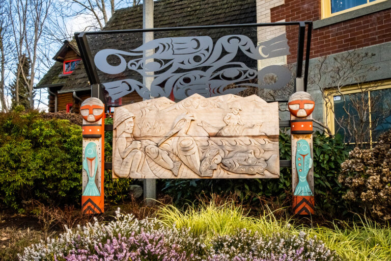 The sculpture “Marsh Life” is a carved mural by artist Ty Juvinel